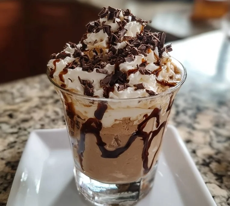 Frozen Mudslide cocktail topped with chocolate and whipped cream