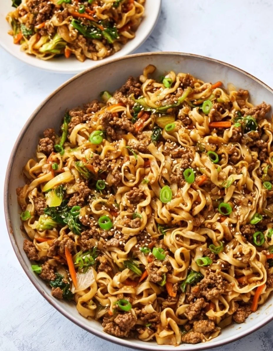 Creamy pork noodles dish with fresh ingredients and rich sauce