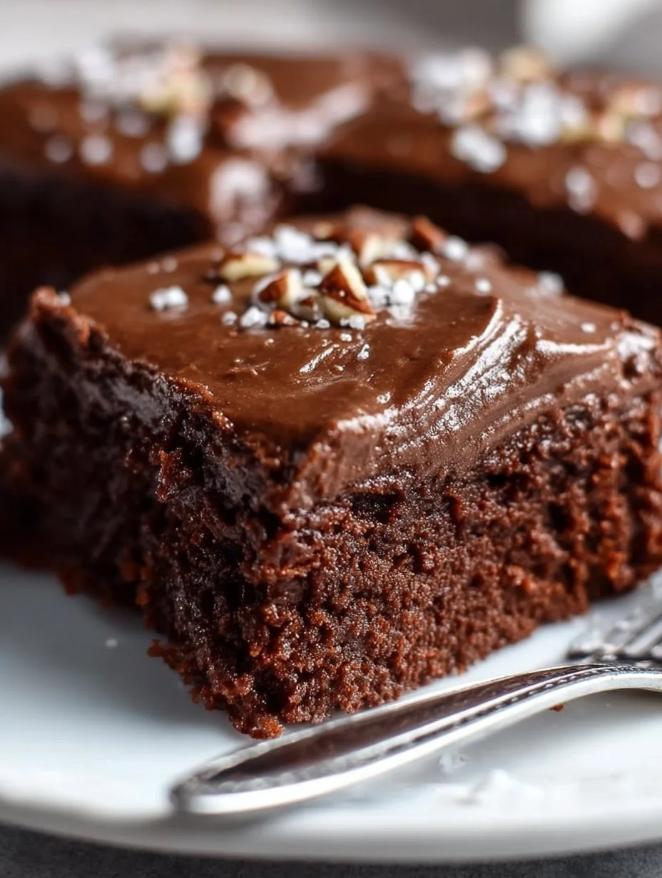 Delicious Texas Sheet Cake with chocolate frosting served on a baking sheet.