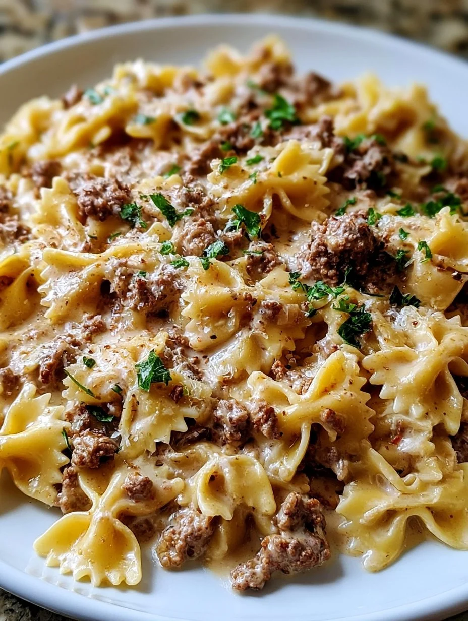 Creamy Parmesan garlic beef bowtie pasta served in a bowl