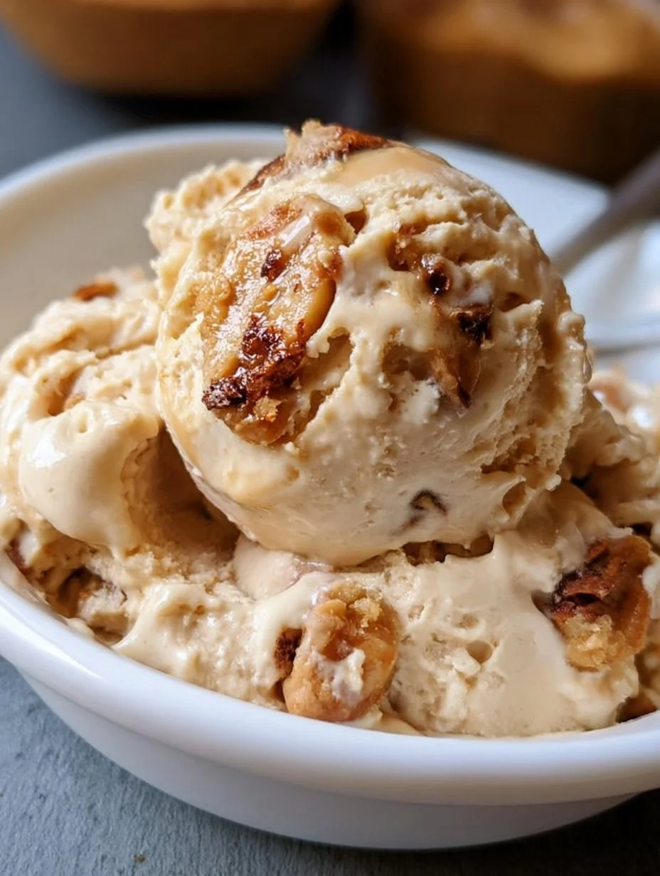 Bowl of homemade peanut butter ice cream topped with crushed peanuts