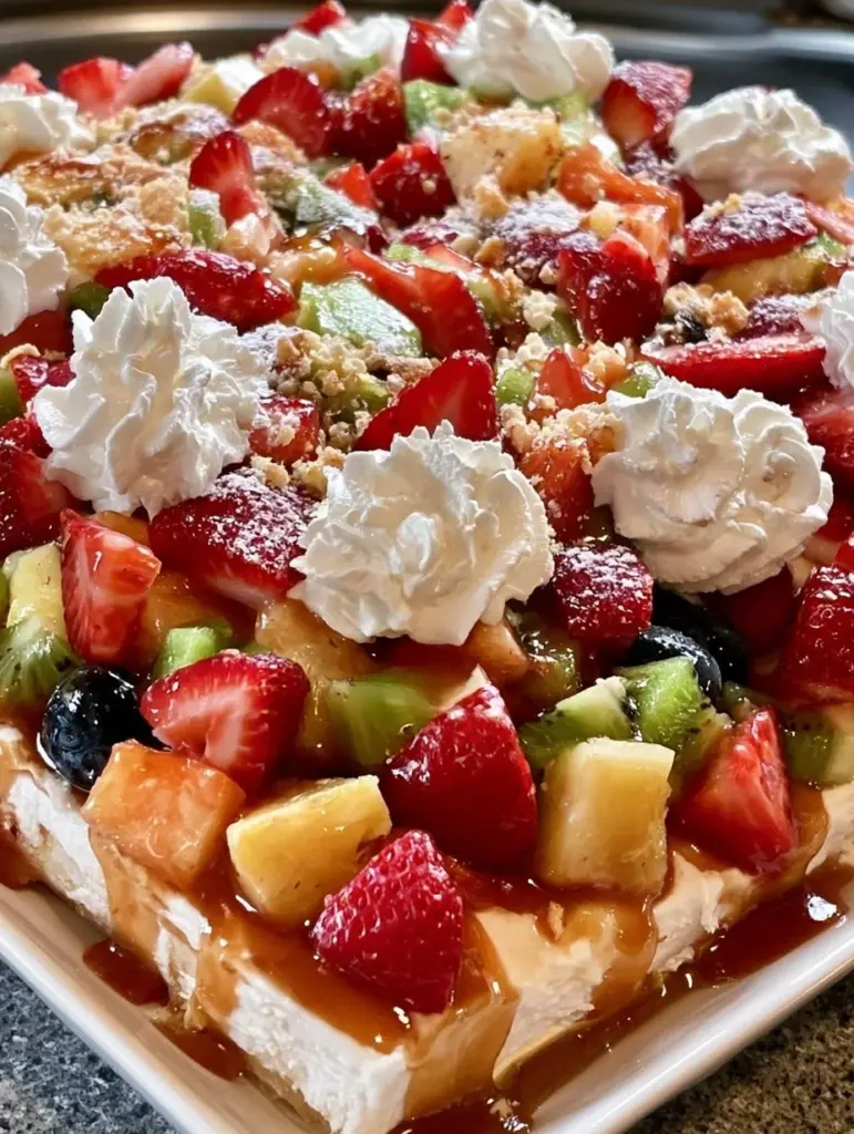 Delicious cheesecake fruit salad with fresh fruits and creamy topping